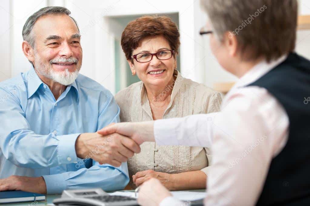 Insurance agent meeting with clients to review their coverage